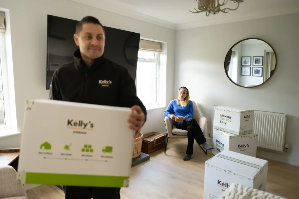 Customer relaxing as Kelly's staff help pack and load all their items.