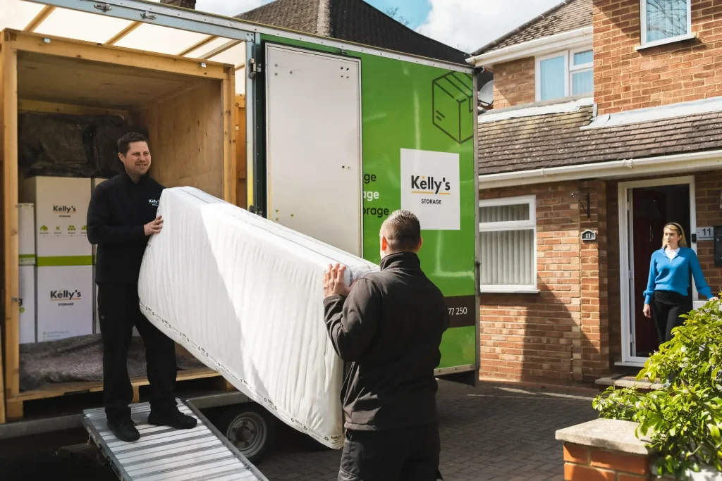 Kelly's staff loading customers items into one of our vans.