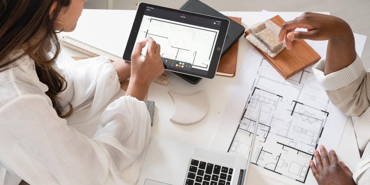 Picture of two workers at an architecture firm creating a design